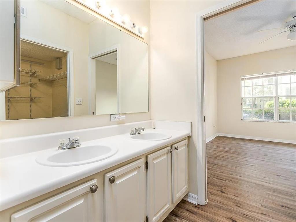 10000 Southwest 52nd Avenue, Unit 99 Gainesville, FL 32608 - Photo 14 of 19 a bathroom with a sink and a mirror