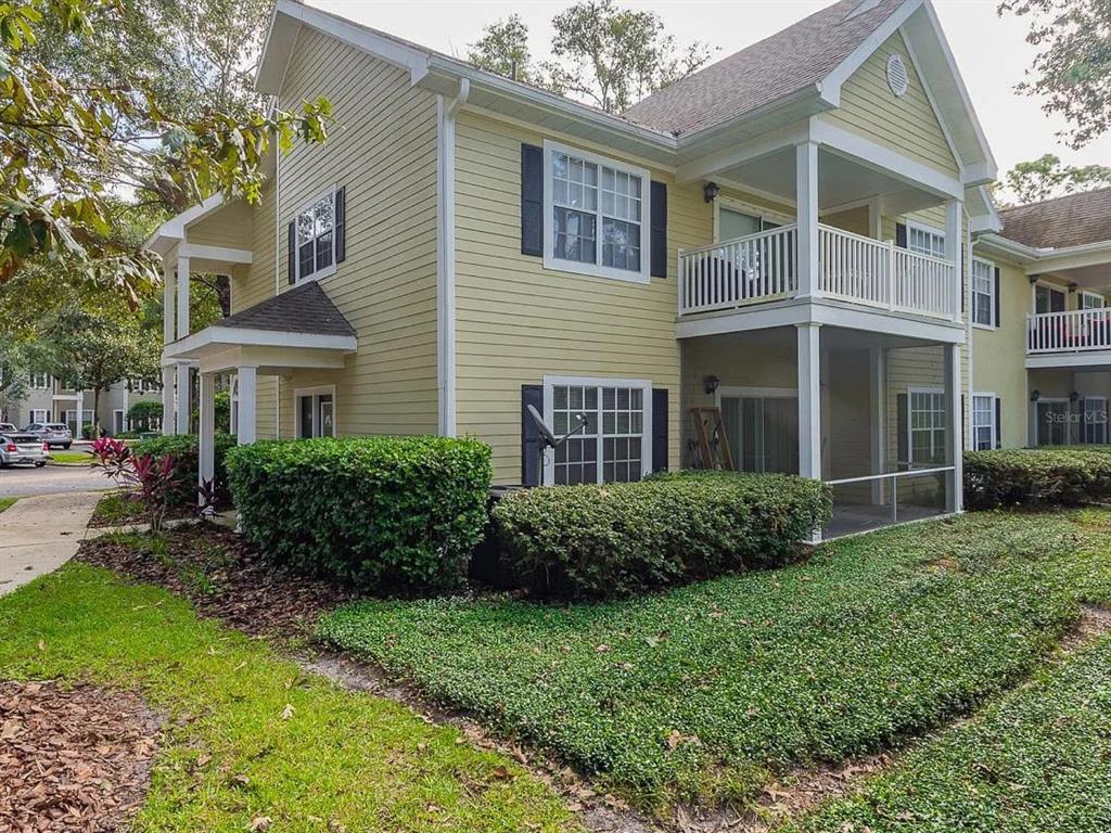 10000 Southwest 52nd Avenue, Unit 99 Gainesville, FL 32608 - Photo 19 of 19 a view of a brick house with a yard and plants