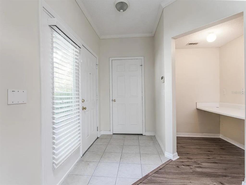 10000 Southwest 52nd Avenue, Unit 99 Gainesville, FL 32608 - Photo 3 of 19 a view of a room with an empty space and a window