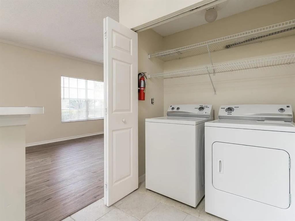 10000 Southwest 52nd Avenue, Unit 99 Gainesville, FL 32608 - Photo 8 of 19 a utility room with dryer and washer