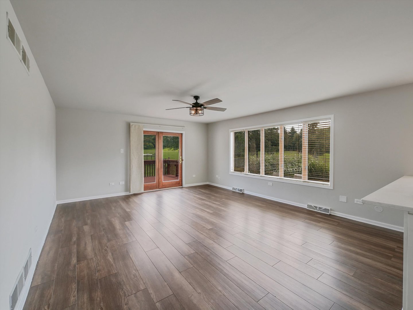 7240 West Colleen Court Monee, IL 60449 - Photo 16 of 57 a view of room with wooden floor and ceiling fan