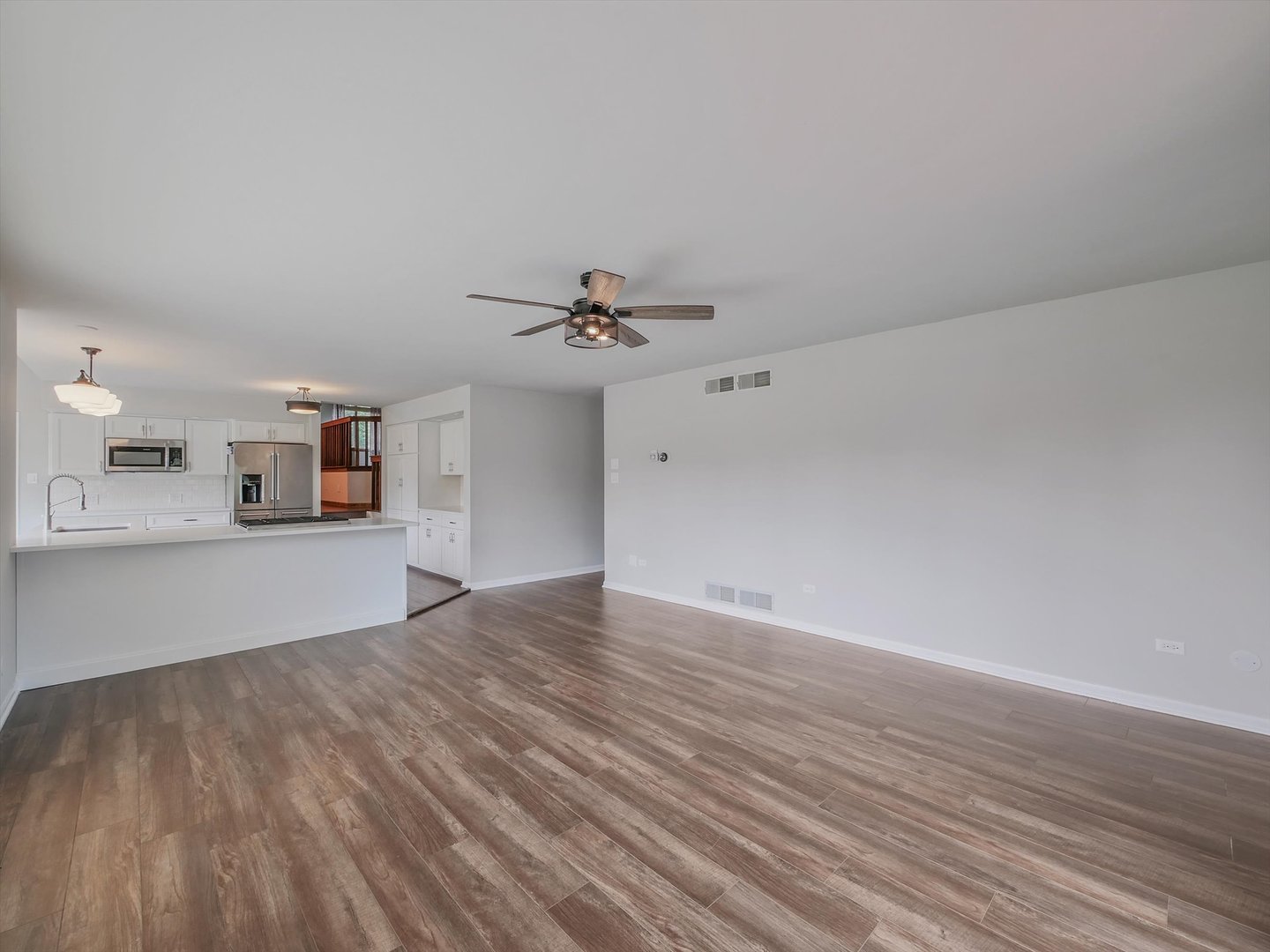 7240 West Colleen Court Monee, IL 60449 - Photo 17 of 57 a view of empty room with wooden floor and fan