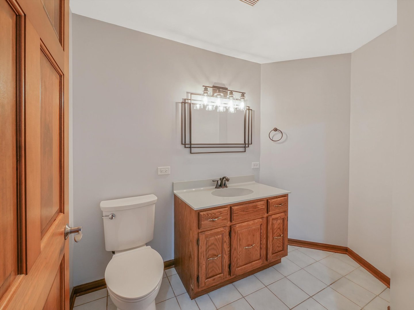 7240 West Colleen Court Monee, IL 60449 - Photo 18 of 57 a bathroom with a toilet a sink and mirror