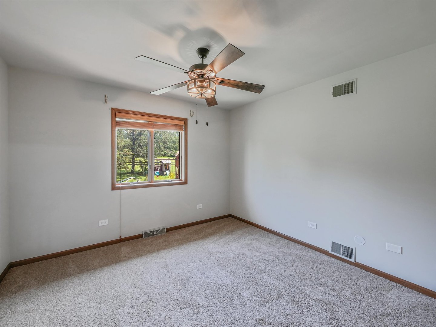 7240 West Colleen Court Monee, IL 60449 - Photo 26 of 57 an empty room with windows and fan