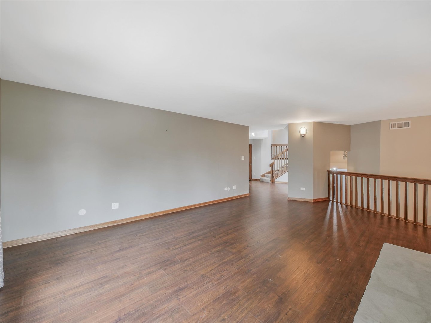 7240 West Colleen Court Monee, IL 60449 - Photo 10 of 57 a view of an empty room with wooden floor and a window