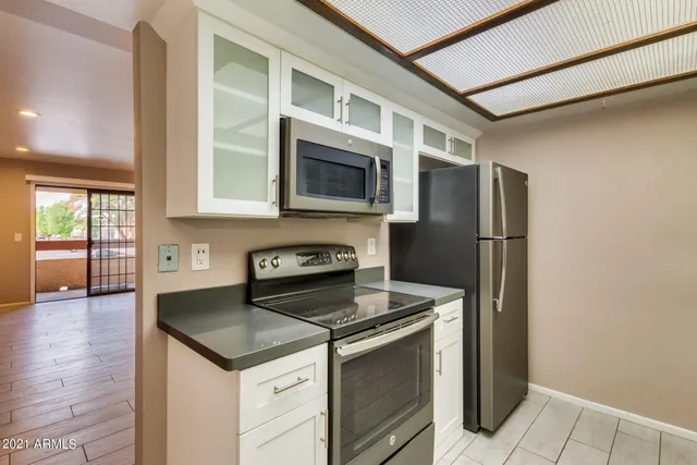 a kitchen with a stove and a refrigerator