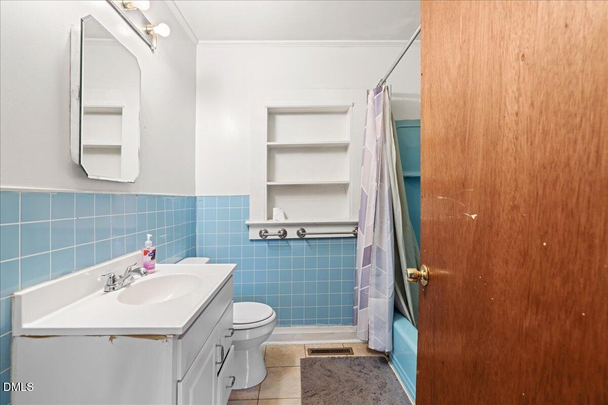 109 Little Ponderosa Road Macon, NC 27551 - Photo 20 of 32 a bathroom with a sink toilet and shower