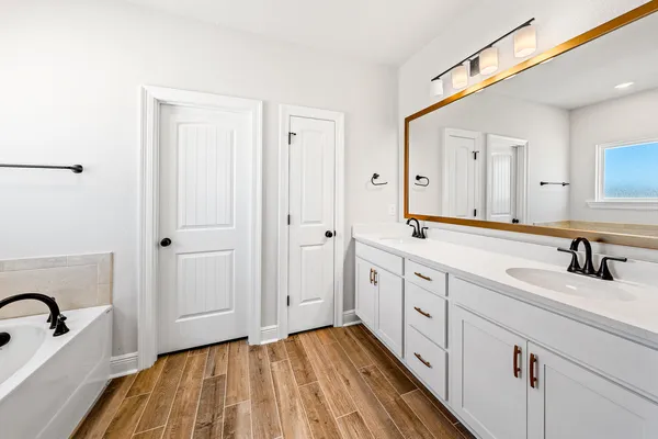 a bathroom with a bathtub and shower