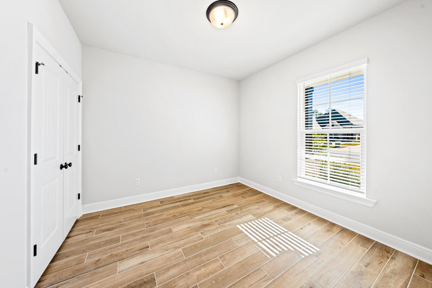 165 Splendor Run Ponce de Leon, FL 32455 - Photo 16 of 24 a view of a room with wooden floor and window
