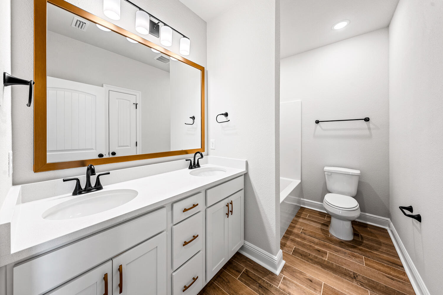 165 Splendor Run Ponce de Leon, FL 32455 - Photo 17 of 24 a bathroom with a toilet sink and mirror