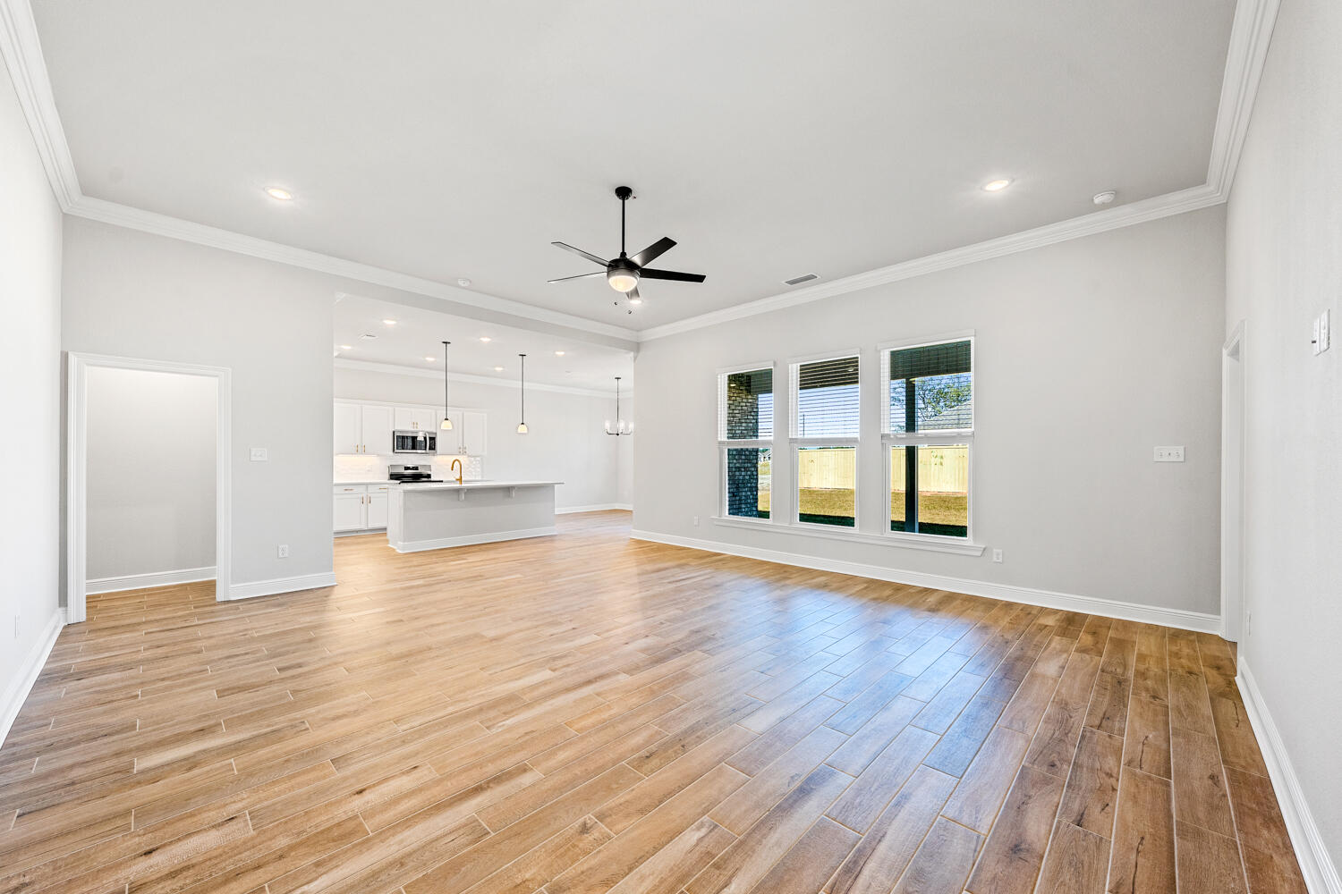 165 Splendor Run Ponce de Leon, FL 32455 - Photo 9 of 24 a view of empty room with wooden floor and window