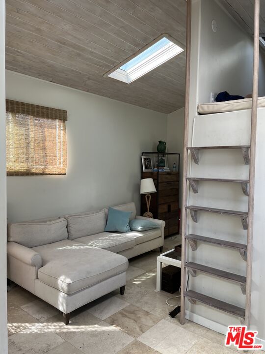 36 Paradise Cove Road Malibu, CA 90265 - Photo 3 of 8 a living room with furniture and a flat screen tv