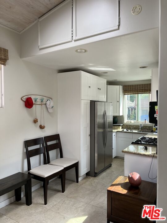 36 Paradise Cove Road Malibu, CA 90265 - Photo 4 of 8 a kitchen with refrigerator and cabinets