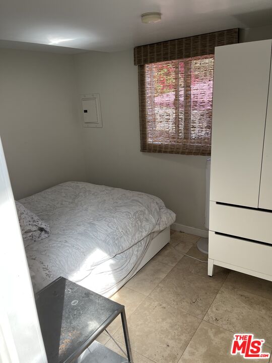 36 Paradise Cove Road Malibu, CA 90265 - Photo 5 of 8 a bedroom with a bed and a window