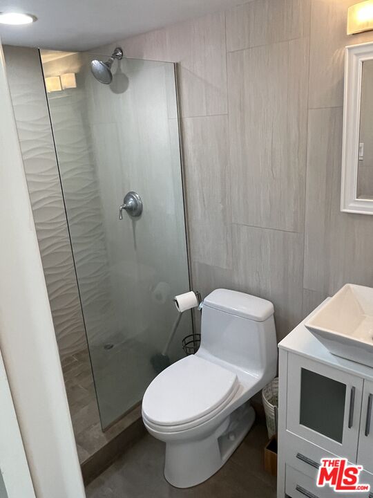 36 Paradise Cove Road Malibu, CA 90265 - Photo 7 of 8 a white toilet sitting next to a bathroom sink