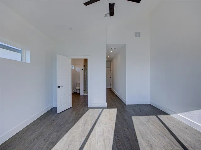 a bathroom with a granite countertop sink mirror toilet and shower