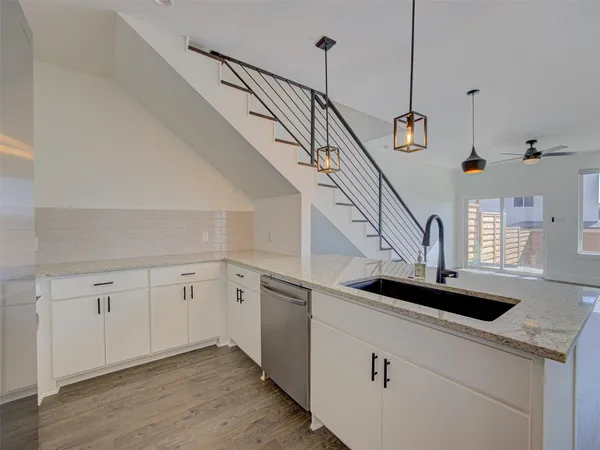 a stove top oven sitting inside of a kitchen