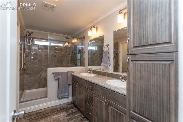 11025 Milne Road Colorado Springs, CO 80928 - Photo 28 of 41 Primary bath in three-bedroom home