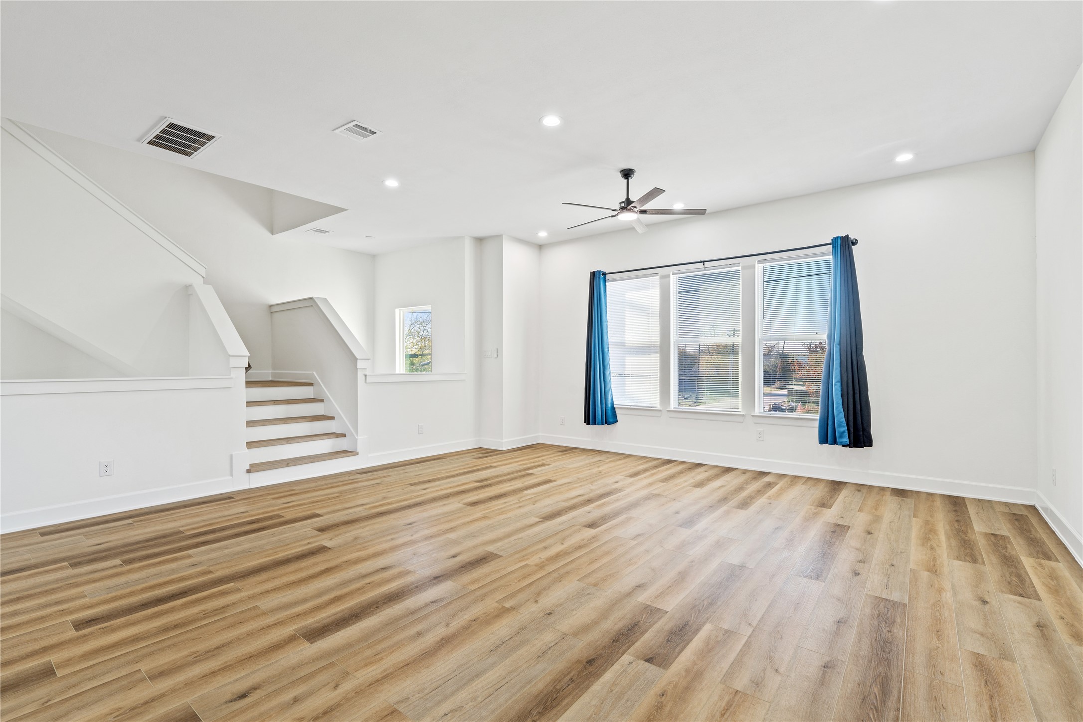 3601 Rebecca Street, Unit A Houston, TX 77021 - Photo 18 of 29 a view of an empty room with wooden floor and a window