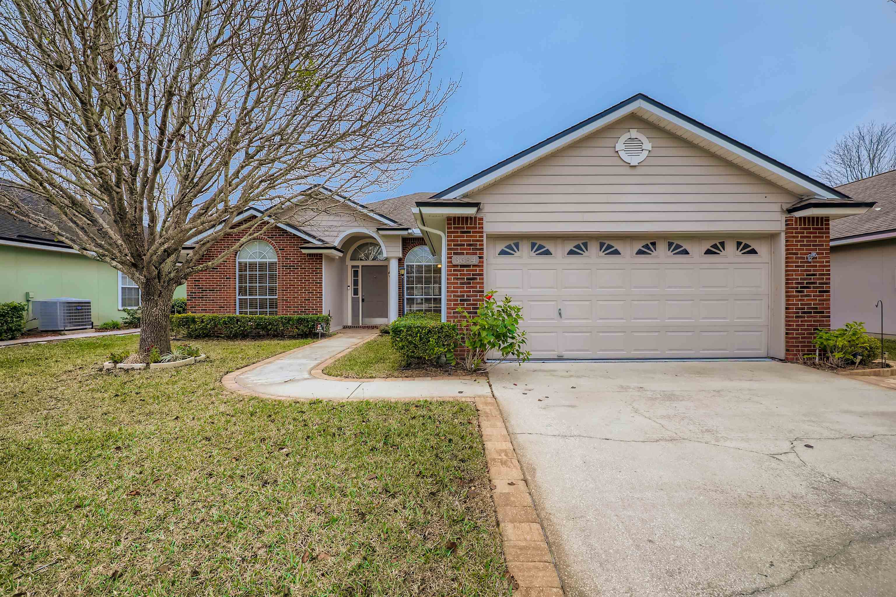 3684 Eagle Ridge Drive Jacksonville, FL 32224 - Photo 1 of 33 a view of a large house with a yard