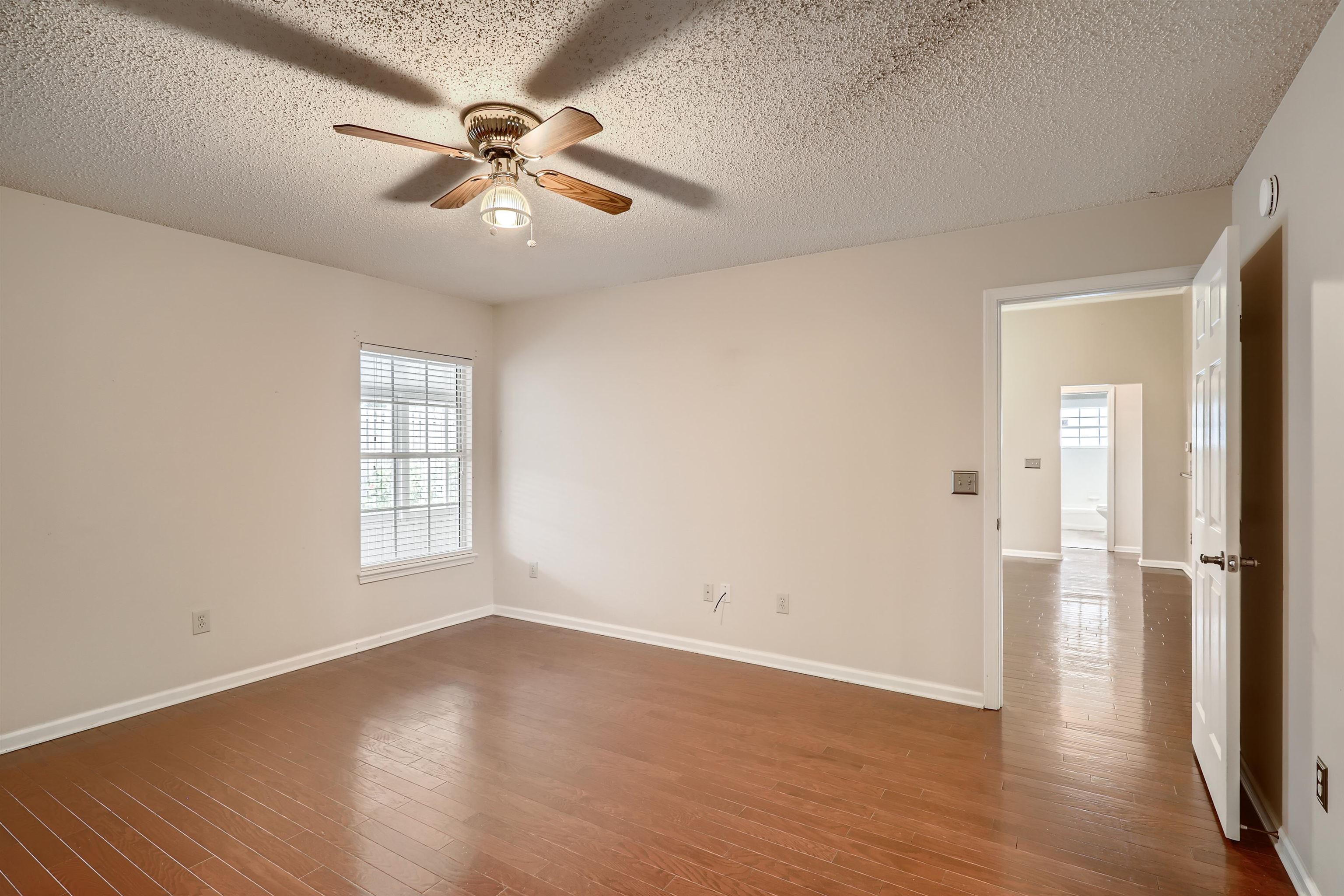 3684 Eagle Ridge Drive Jacksonville, FL 32224 - Photo 15 of 33 wooden floor in an empty room with a window
