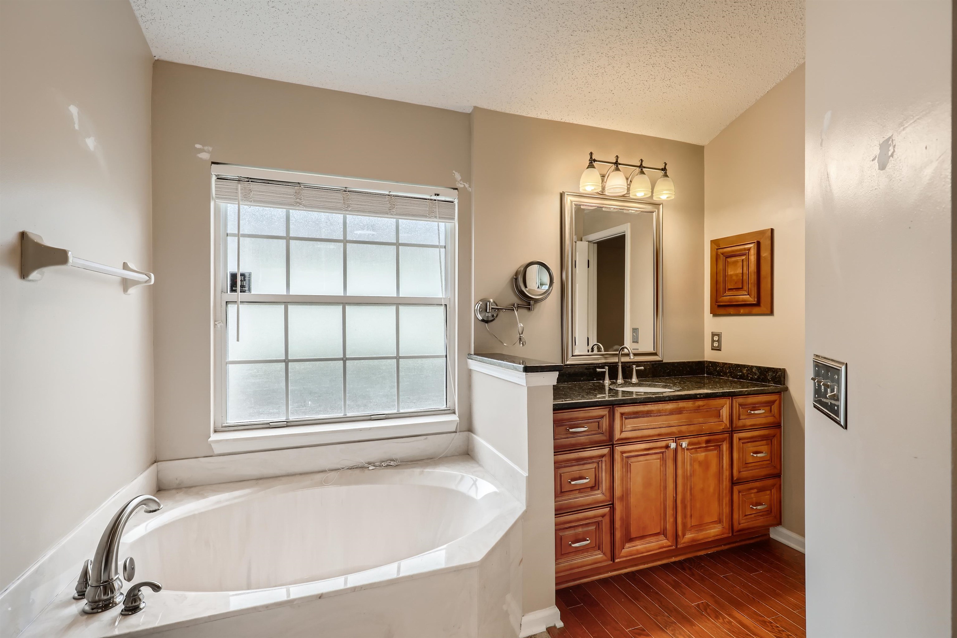 3684 Eagle Ridge Drive Jacksonville, FL 32224 - Photo 20 of 33 a bathroom with a granite countertop tub sink and mirror