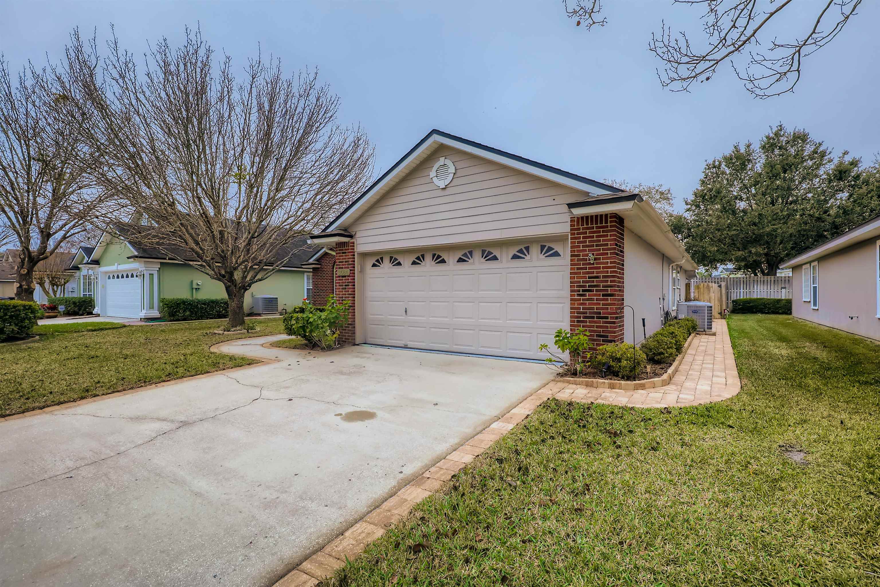 3684 Eagle Ridge Drive Jacksonville, FL 32224 - Photo 2 of 33 a front view of a house with a yard and garage