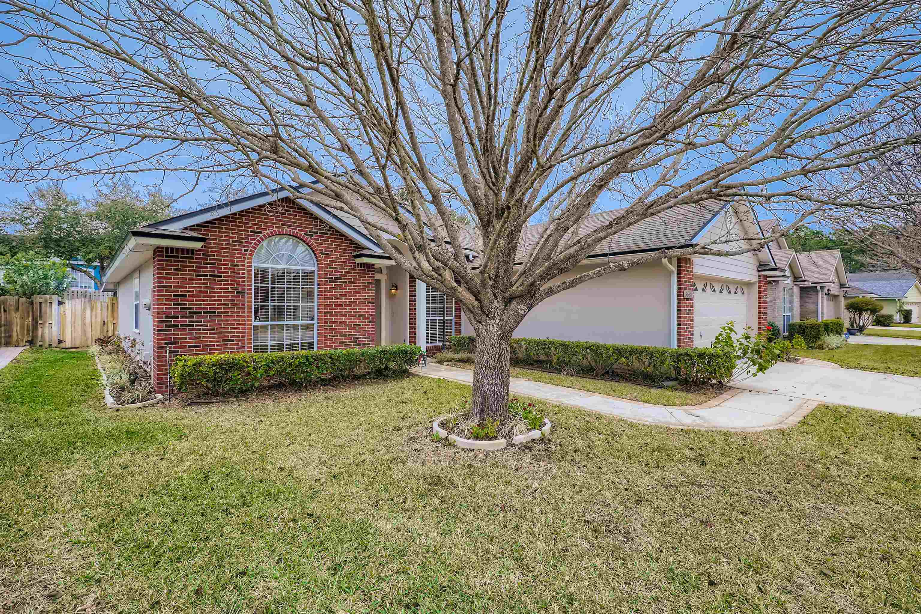 3684 Eagle Ridge Drive Jacksonville, FL 32224 - Photo 3 of 33 a front view of a house with garden