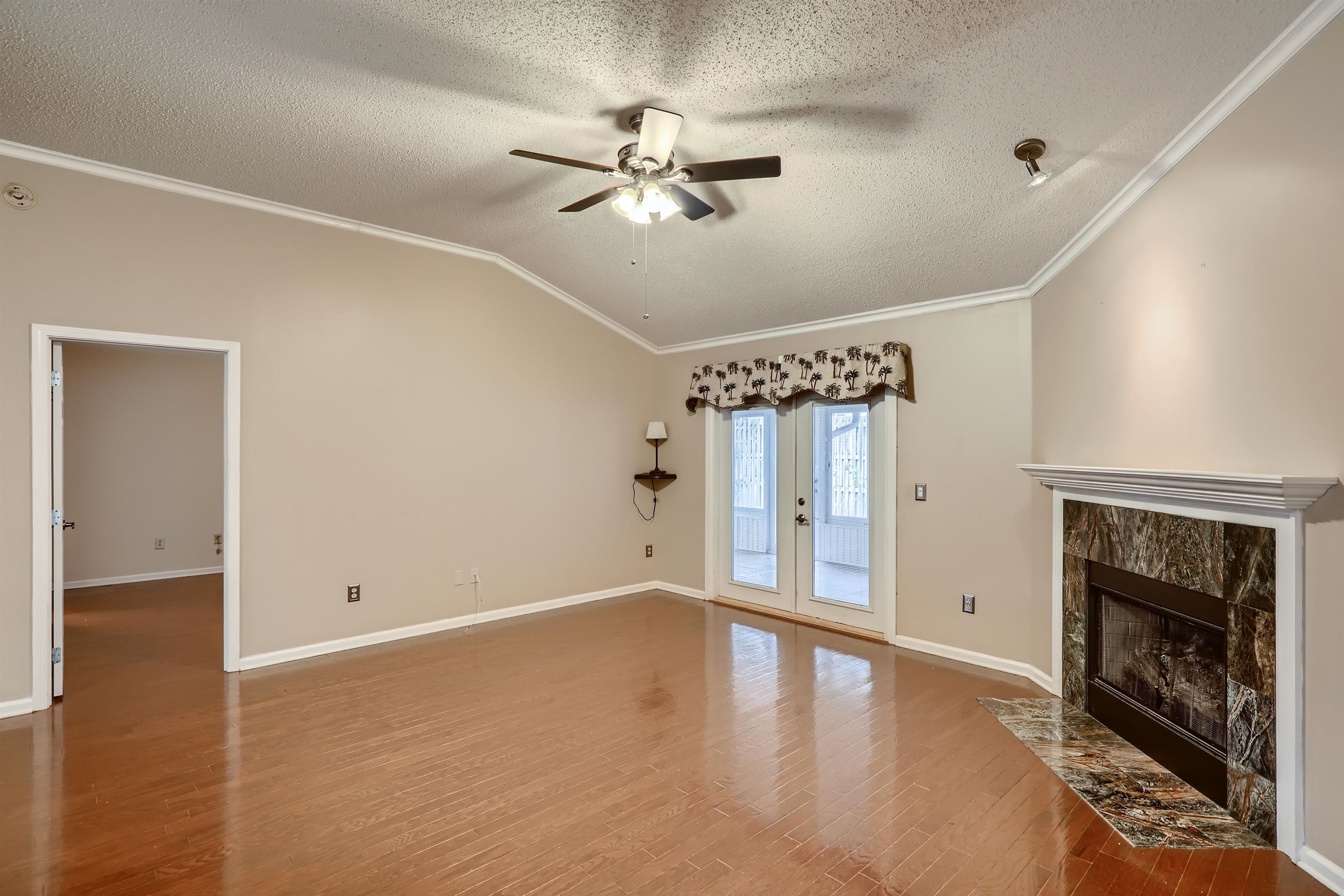 3684 Eagle Ridge Drive Jacksonville, FL 32224 - Photo 6 of 33 a view of an empty room with a ceiling fan and window