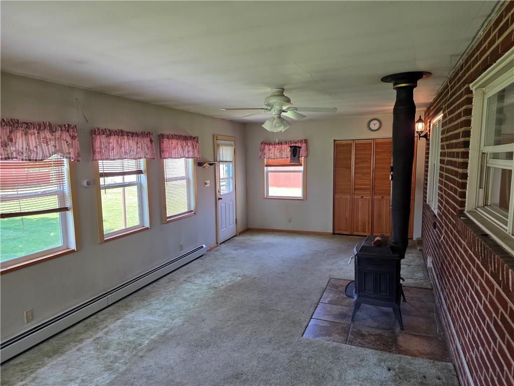 3134 Roxford Road Allentown, PA 18103 - Photo 21 of 34 A welcoming interior with a classic wood-burning stove provides cozy warmth and timeless appeal.
