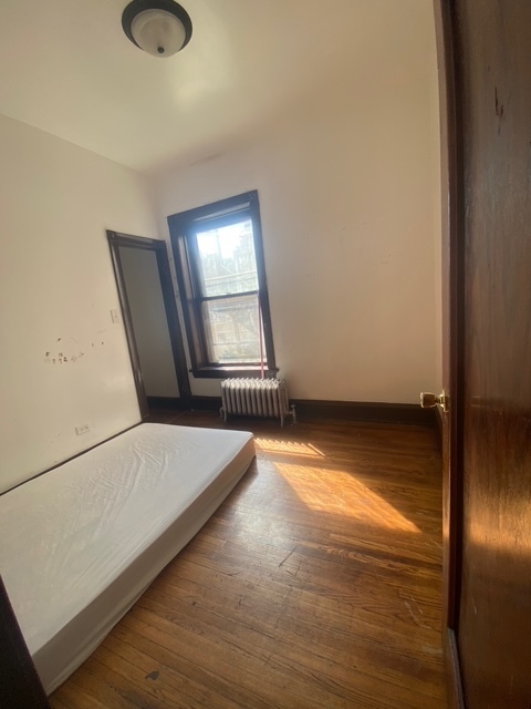 3903 West Monroe Street Chicago, IL 60624 - Photo 6 of 9 a view of an empty room and window