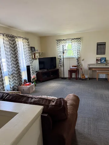a bathroom with double sink and a mirror
