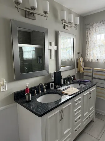 a white toilet sitting next to a white wall