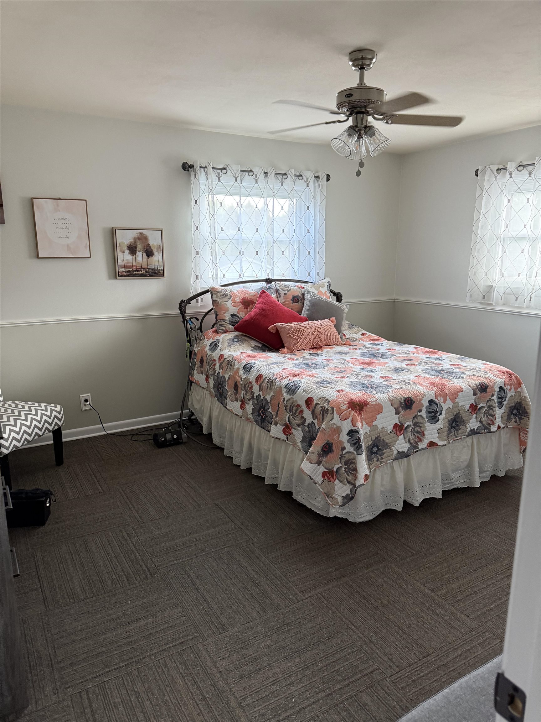 1909 West Laurel Street Freeport, IL 61032 - Photo 29 of 32 a bedroom with a bed and a chandelier