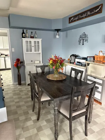 a kitchen with a sink a counter top space and stainless steel appliances