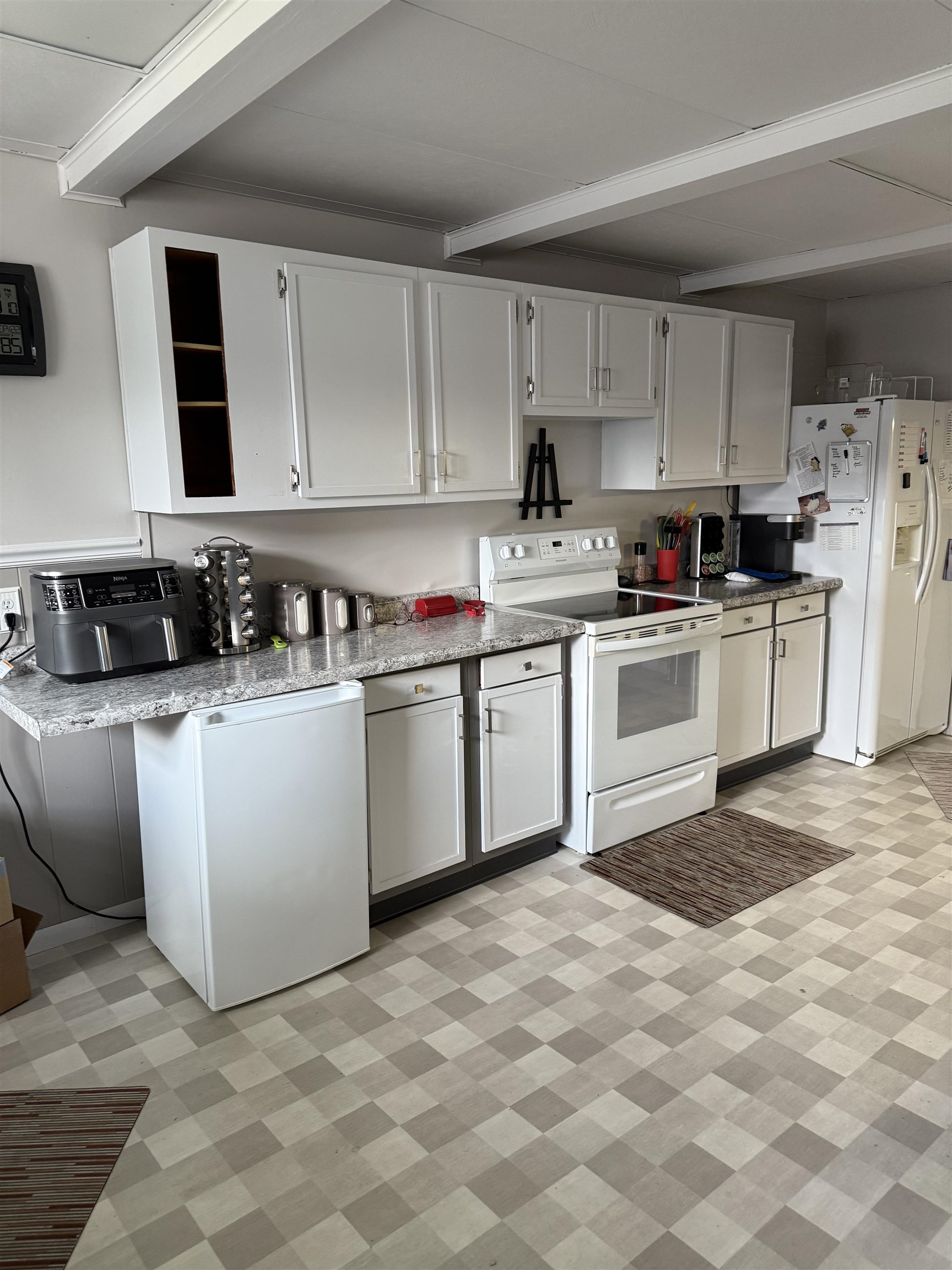 1909 West Laurel Street Freeport, IL 61032 - Photo 10 of 32 a kitchen with cabinets a sink and white appliances