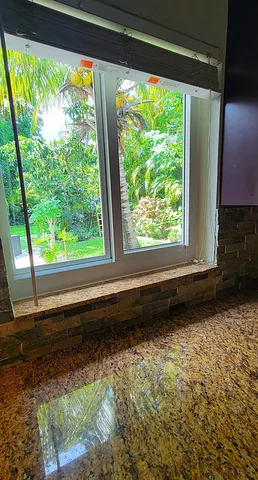 a workspace with furniture and a window