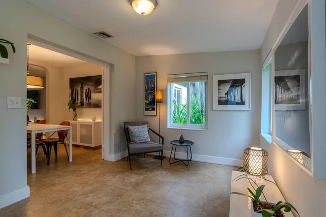 a living room with furniture and a window