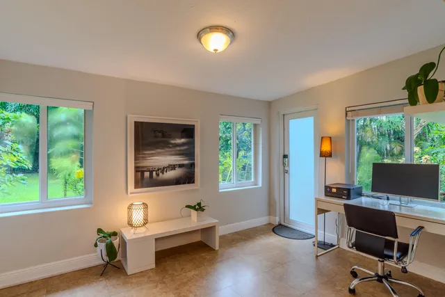 a bedroom with a bed and a table in it