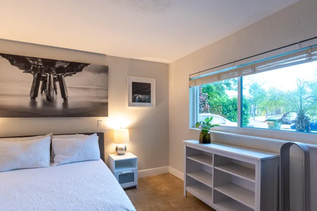 a bedroom with a bed and walk in closet