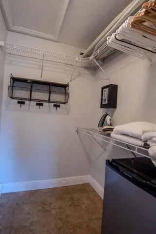 a bedroom with a bed and lamp