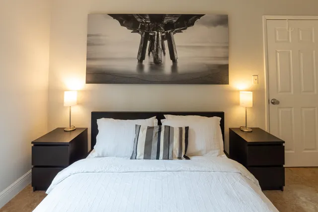 a living room with furniture and a ceiling fan