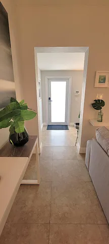 a view of a livingroom with furniture and a window