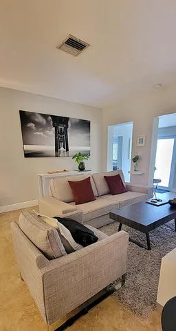 a living room with furniture and a table