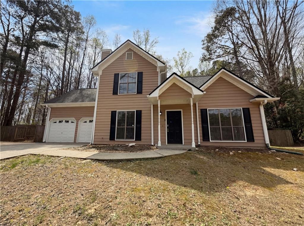 26 Lakeview Terrace Dallas, GA 30132 - Photo 1 of 1 a front view of a house with a garden