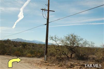 14674 East Colossal Cave Road Vail, AZ 85641 - Photo 9 of 11 This is the telphone pole just past the tan barn, turn right here and proceed to the property. You will see the for sale sign and the address sign on the south side of the easement.