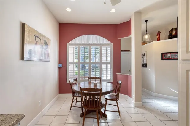 a view of a room with furniture and wooden floor
