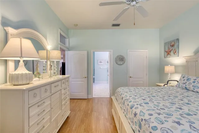 a bedroom with a bed and a mirror