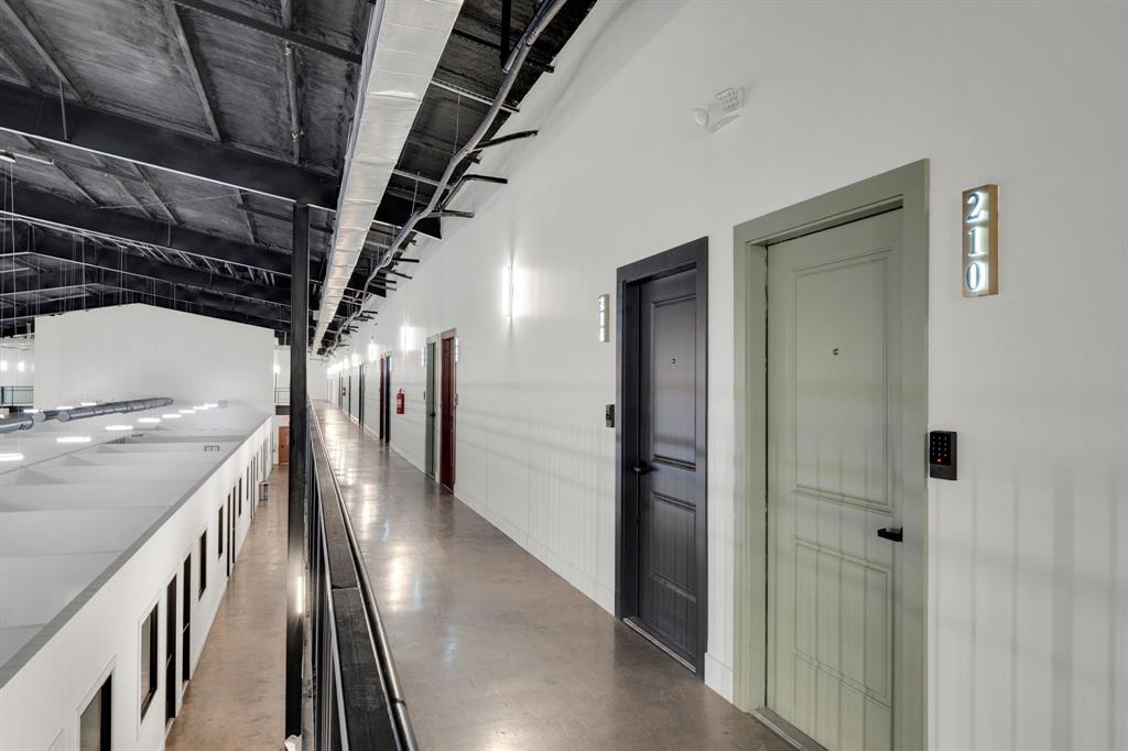 301 West Main Street, Unit 254 Midlothian, TX 76065 - Photo 13 of 18 a view of a hallway with wooden walls