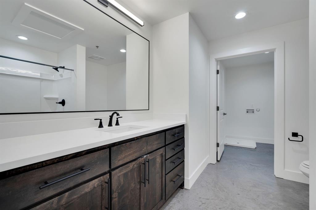 301 West Main Street, Unit 254 Midlothian, TX 76065 - Photo 7 of 18 a bathroom with a sink and a mirror